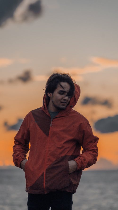 Man Posing in Jacket at Sunset