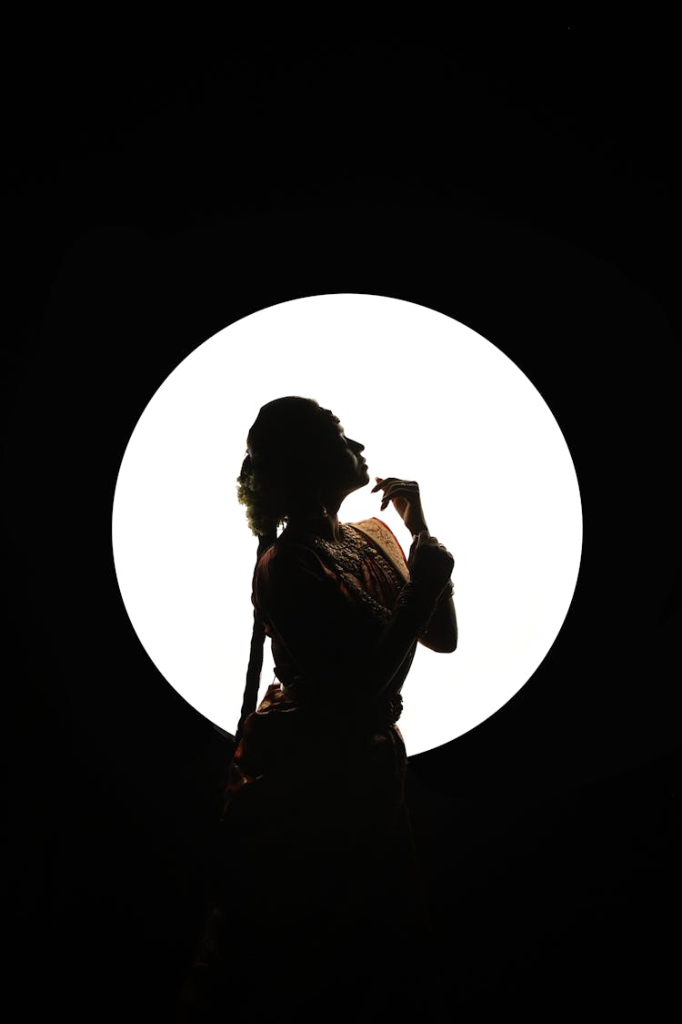 Silhouette Of A Woman In A Circle 