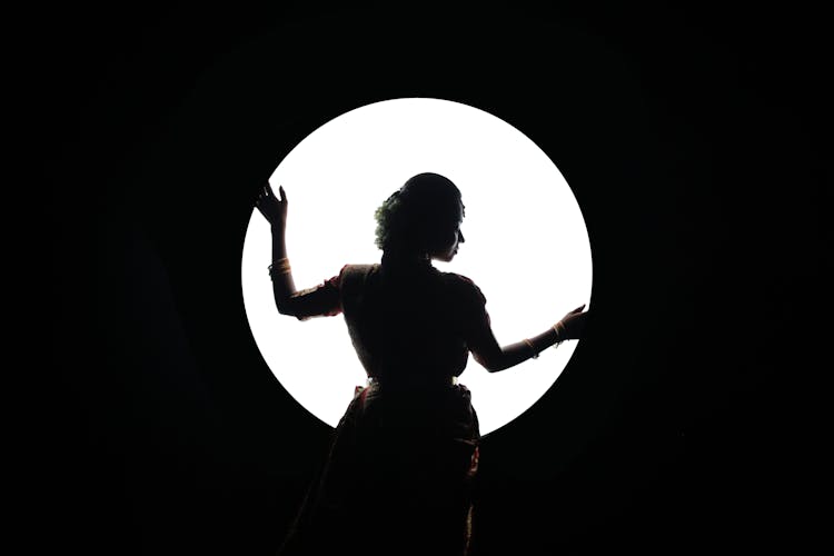 Woman Holding Circular Light