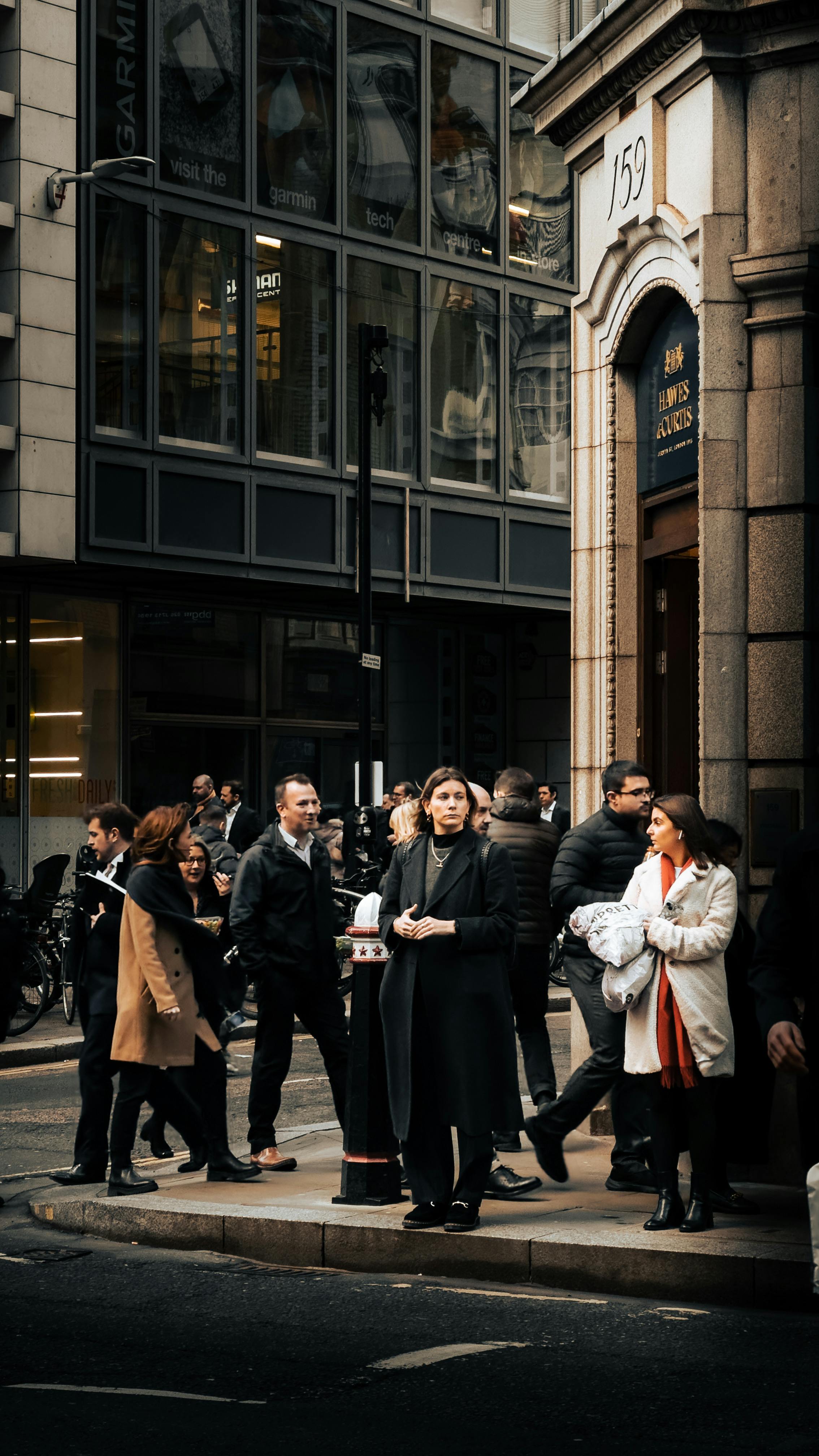 People Walking on the Sidewalk at Dusk · Free Stock Photo