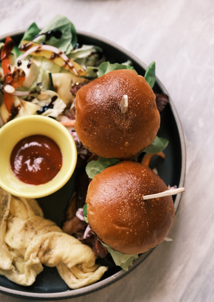 Delicious Burgers And Salad On Plate