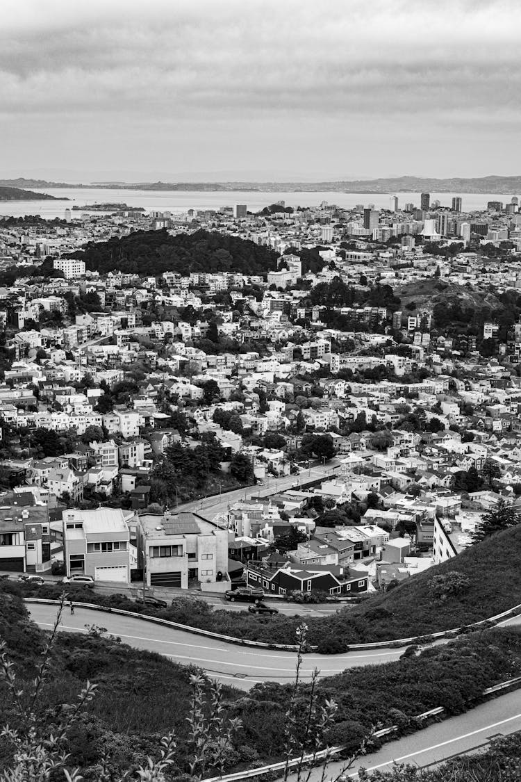 Black And White Aerial View Of City Built On Riverbank