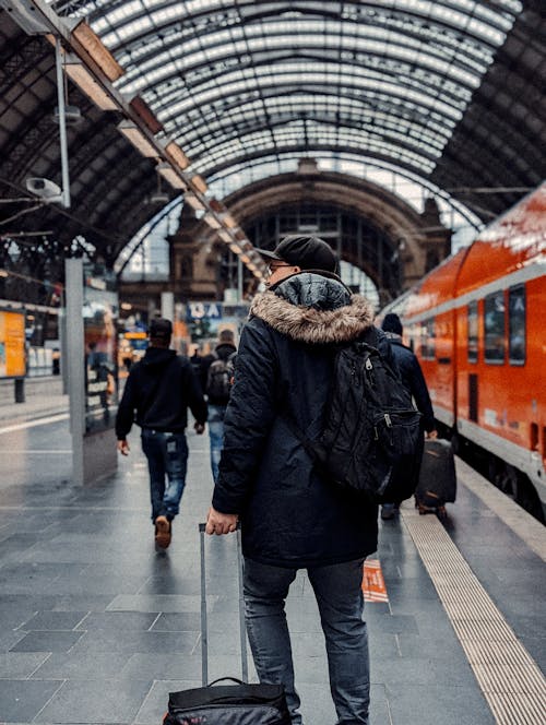 Man with Backpack at Railway Station