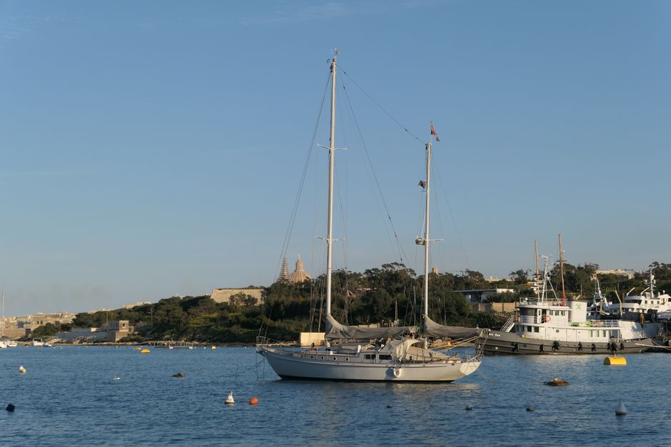 Breathtaking Private Day Charter on Amazing Mowgli Review: Your Ultimate Malta Yacht Experience Review 2026 - A tranquil sailboat floating in the beautiful Sliema harbor, Malta, under a clear summer sky.