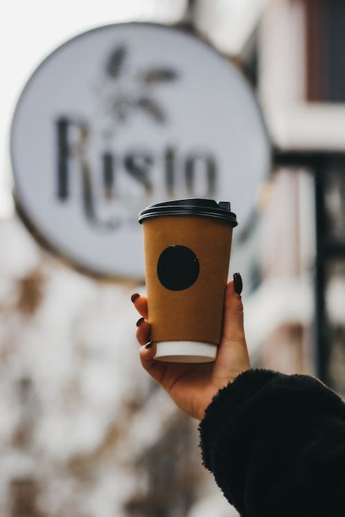 Woman Hand Holding Paper Cup