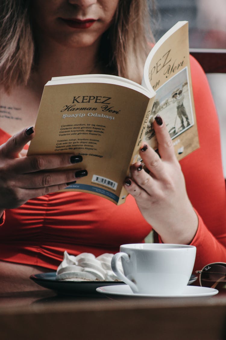 Close Up Of Woman Reading Book