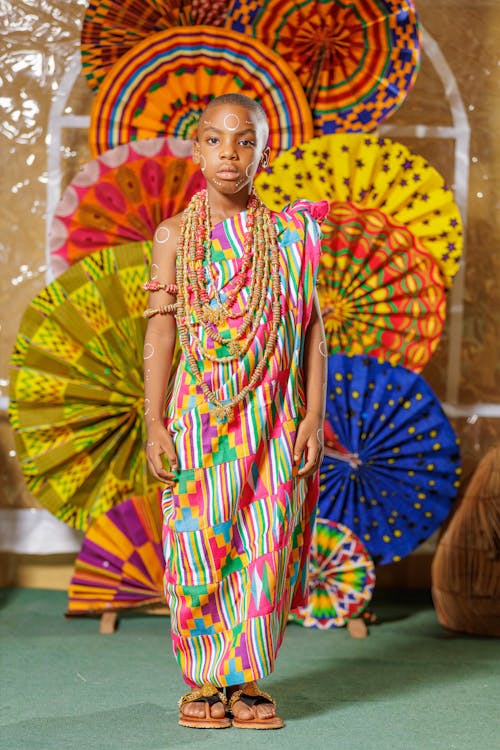 A Girl in Traditional Colorful Gown and Jewelry 