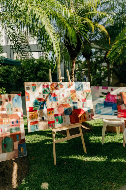 Paintings of Houses on Stands under Trees