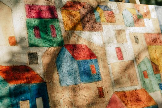 Abstract painting depicting colorful Salvador houses, showcasing vibrant creativity.