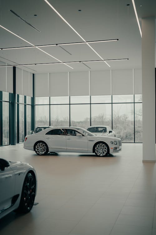 White Car on Display in Showroom