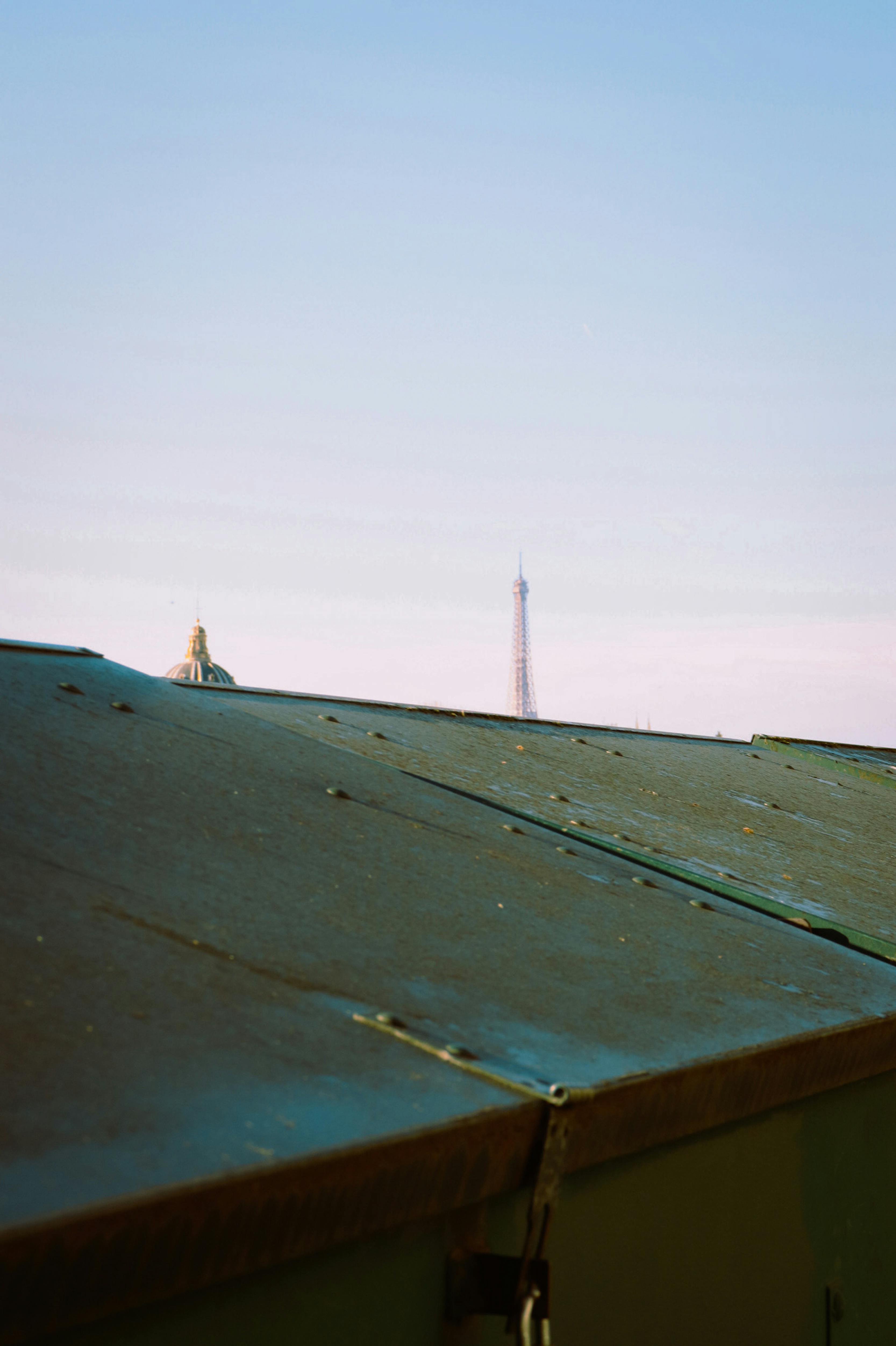 a view of the eiffel tower from a rooftop