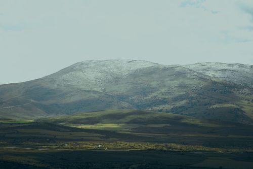 Free Captivating landscape of snow-dusted mountains in Kayseri, Turkey under partly cloudy skies. Stock Photo