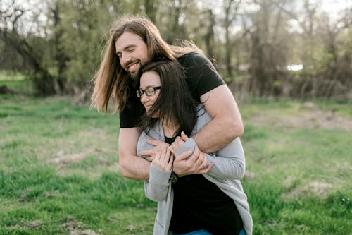 Man Embracing a Girlfriend in the Meadow 