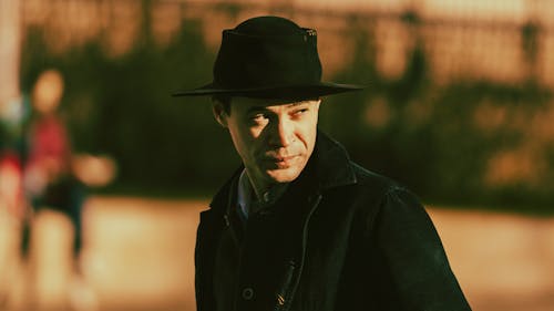 Photo of a Man Wearing a Black Hat
