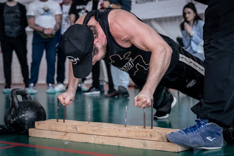 Man Doing Push Ups On Nails