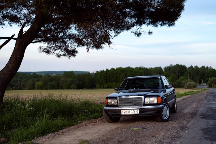 A Car Parked On A Road 