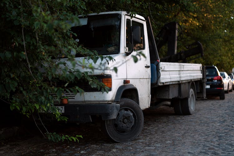 A Truck Parked On A Road 