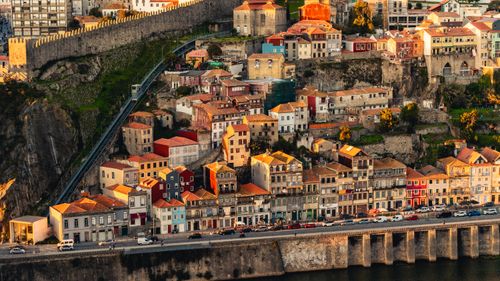 Free Aerial view of historic buildings on a hillside in Porto, Portugal, showcasing vibrant architecture and urban landscape. Stock Photo