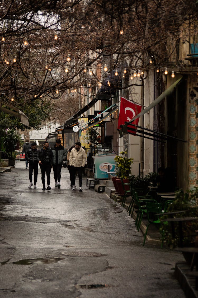 Men Walking In Town