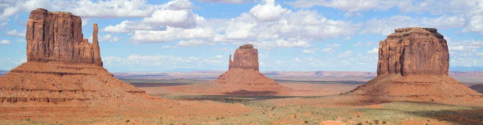 Brown Rock Formation Under White and Blue Cloudy Sky