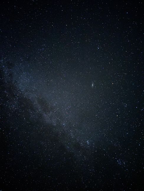 A mesmerizing view of the vast starry night sky above Canada, showcasing stars and galaxies.