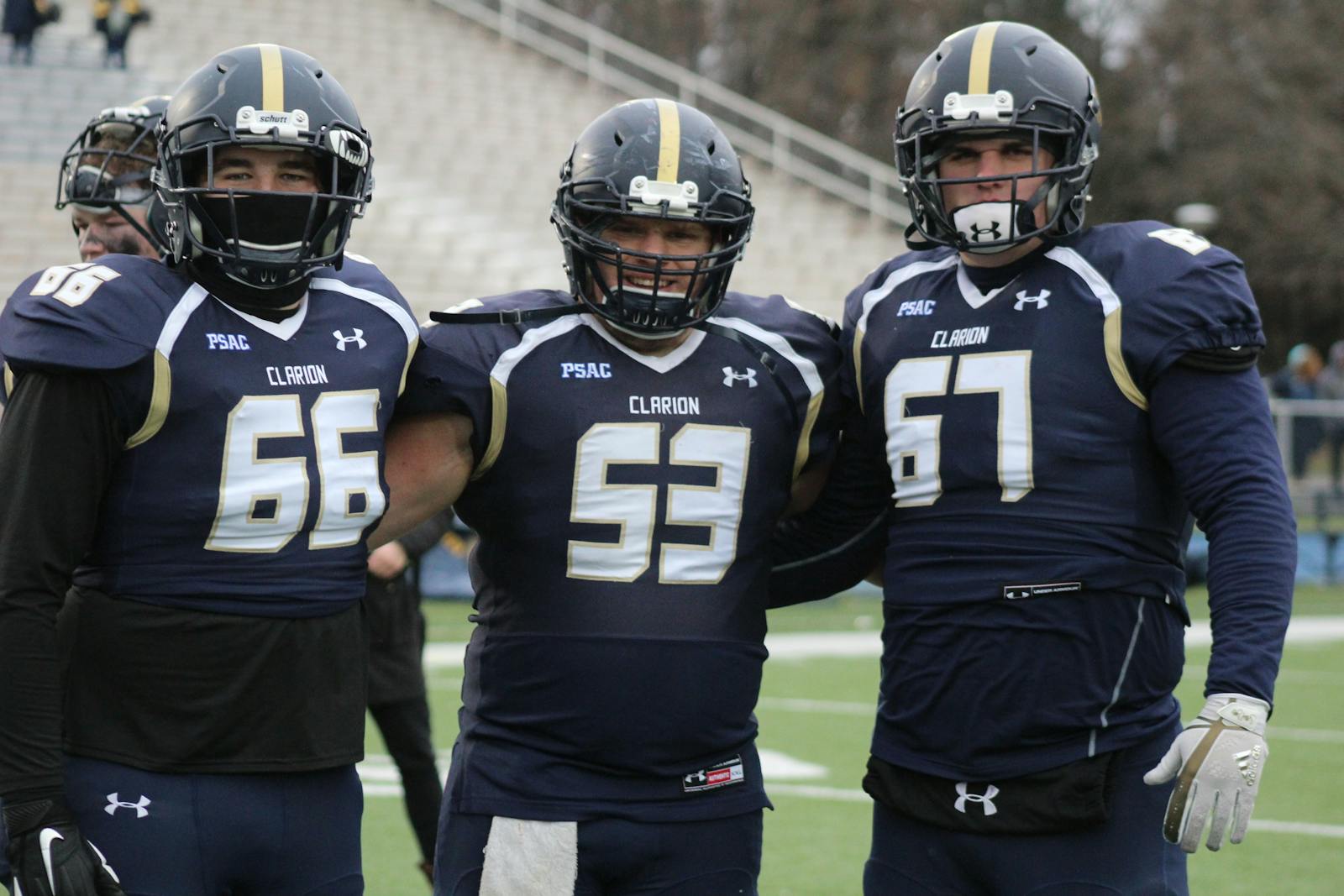 American football players lined up at the line of scrimmage
