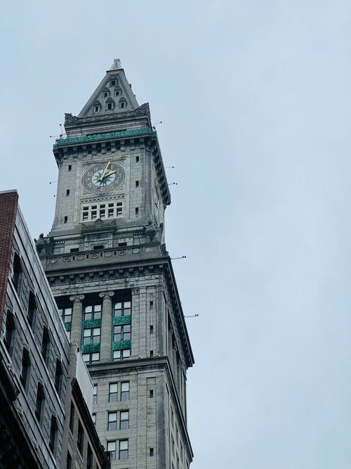 Free Low-angle view of the iconic Custom House Tower in Boston against a cloudy sky. Stock Photo