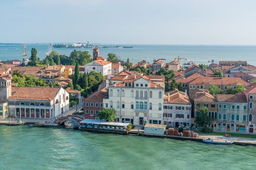 Scenic aerial view of Venice highlighting traditional architecture and calm lagoon waters.