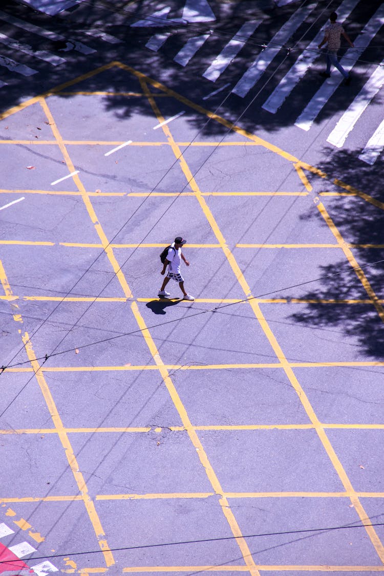 Man Crossing Road With Marking