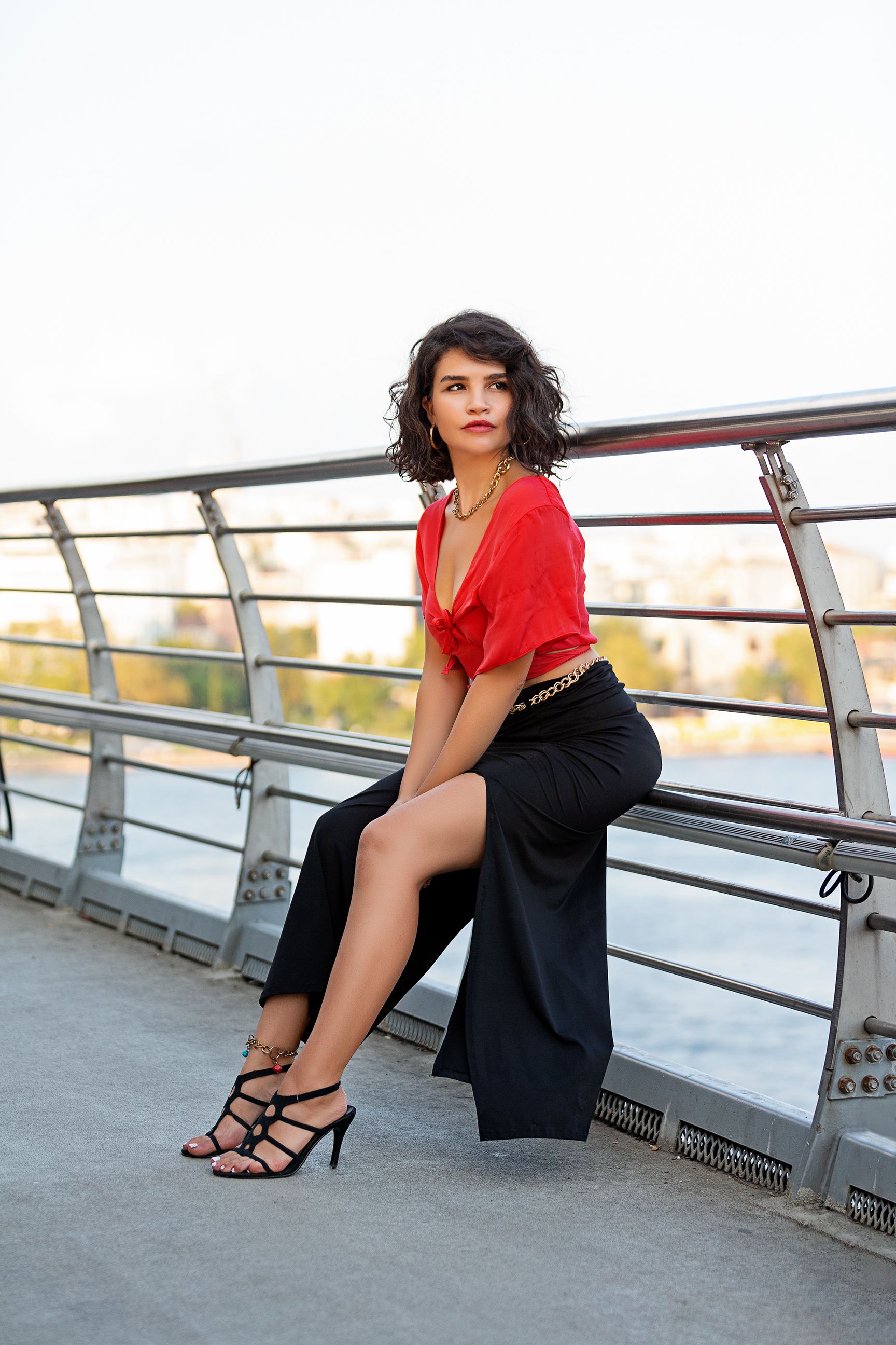 Woman Sitting on a Railing · Free Stock Photo