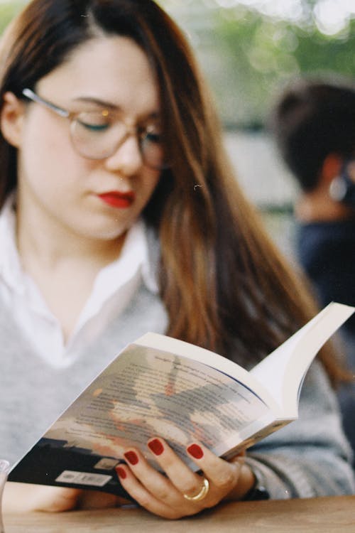 Young Brunette Reading a Book 