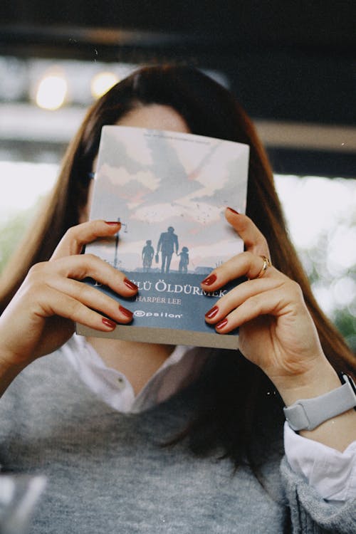 Free Book in Turkish in Woman Hands Stock Photo