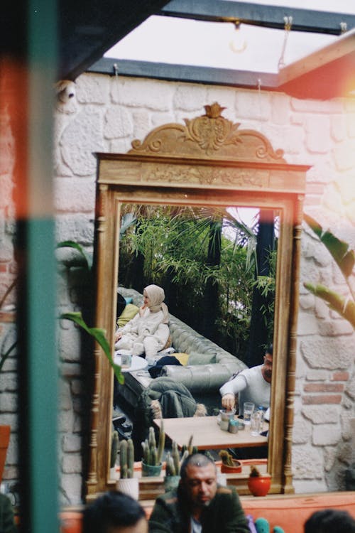 Free Sitting Woman Reflection in Mirror Stock Photo