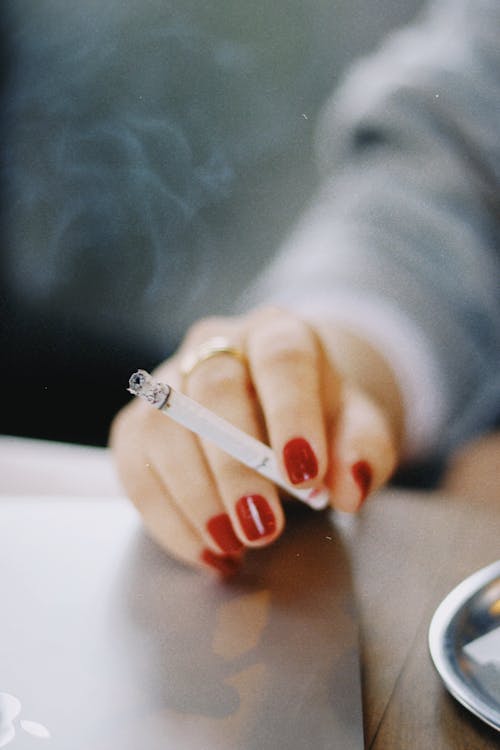 Woman Hand Holding Cigarette