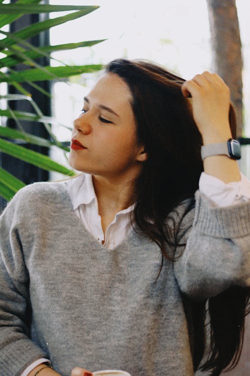 Woman Posing in Gray Sweater