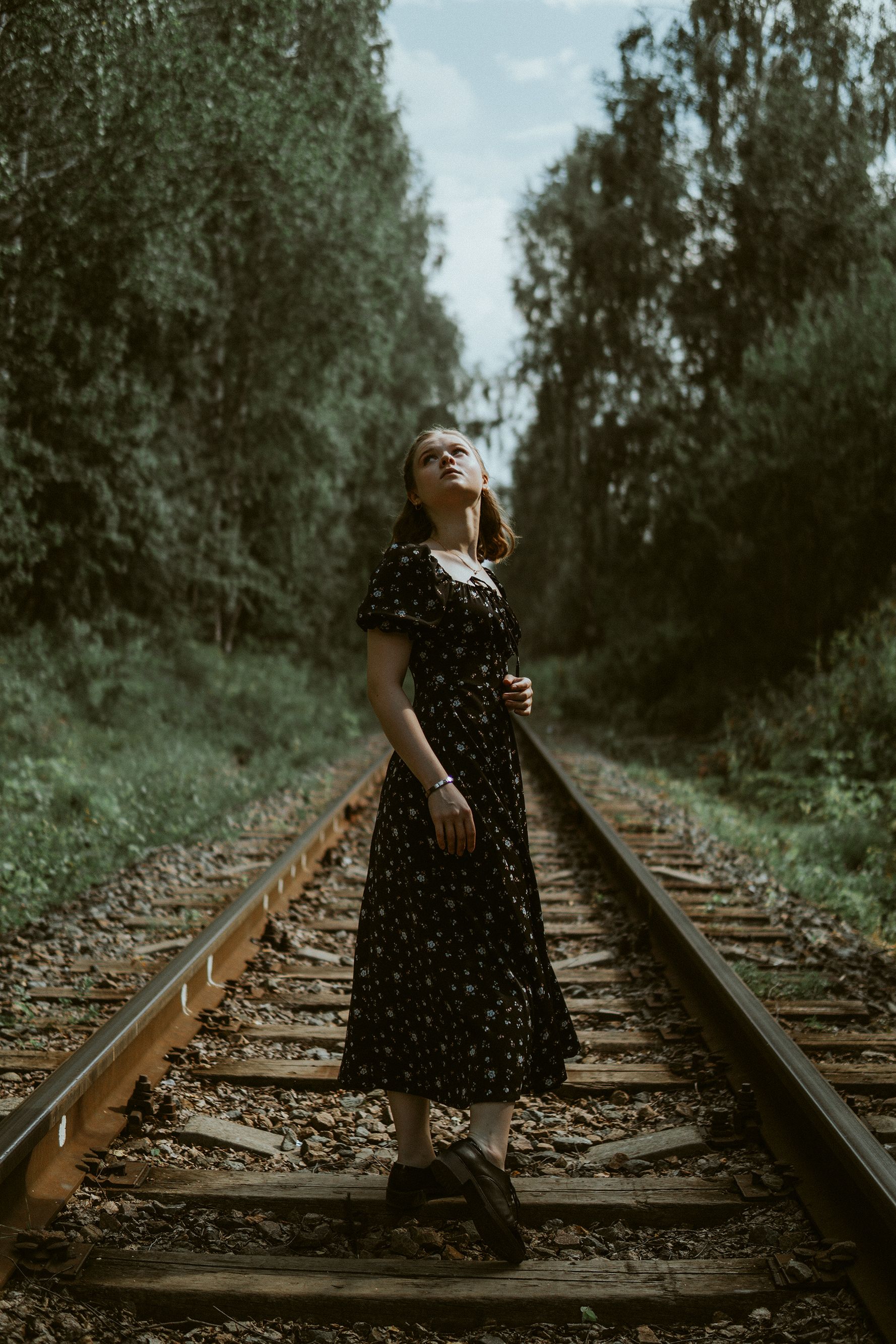 Girl in a Dress Standing on a Railway Track · Free Stock Photo