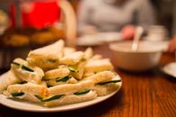Appetizing cucumber tea sandwiches neatly arranged on a plate, perfect for afternoon tea.