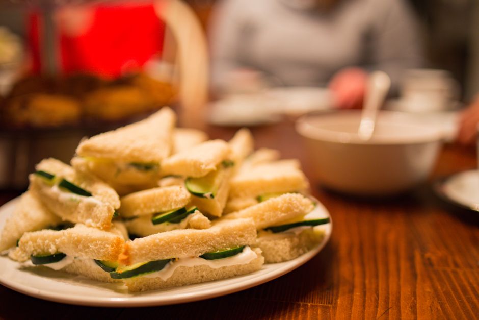 Appetizing cucumber tea sandwiches neatly arranged on a plate, perfect for afternoon tea.