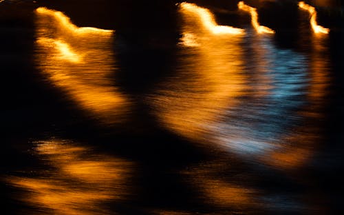 Abstract lights on water surface when on the move