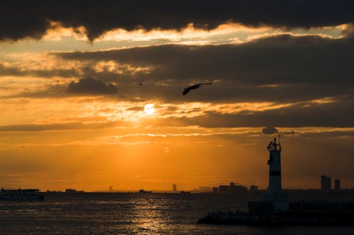 Sunset and Clouds in Istanbul and Lighthouse on Kadikoy Jetty