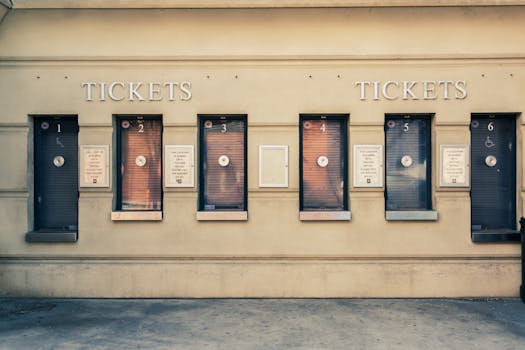 Row of closed ticket booths in Baltimore city center, showcasing urban architecture.