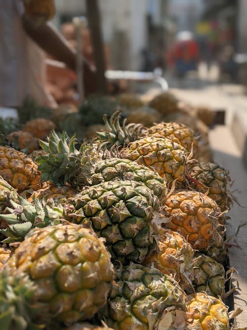 Close-up of a Bunch of Pineapples on the Market Stall 