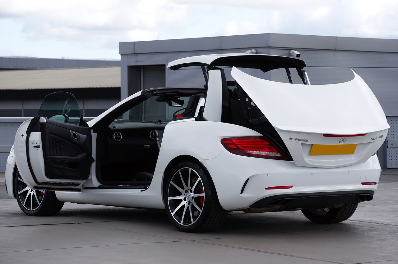 elegant white convertible car with open roof showcasing luxury design