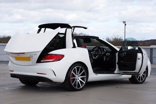 A Modern White Mercedes-Benz SLC with Opened Doors Roof