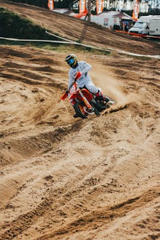 Dynamic motocross racer speeding through a dirt track in Slovakia's Borský Mikuláš.