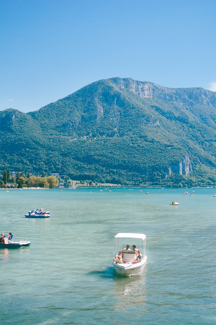 Blue Landscape With A Mountain And Boats On A Sea