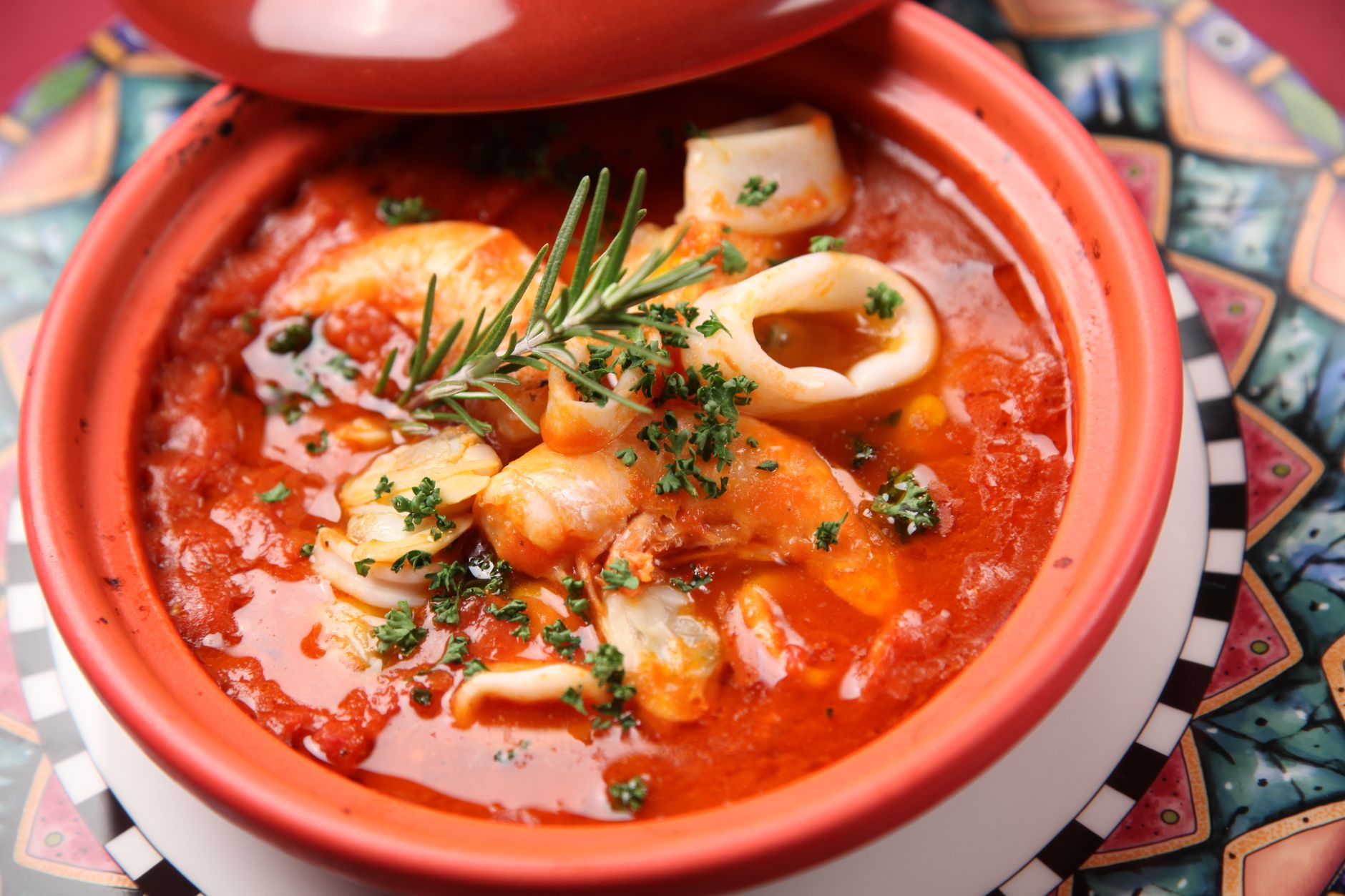 Sizzling skillet with hot Italian sausage and shrimp cooked with vegetables