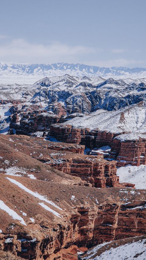 Free Snow-covered Tamerlik Canyon in Kazakhstan showcasing stunning winter scenery and rugged terrain. Stock Photo