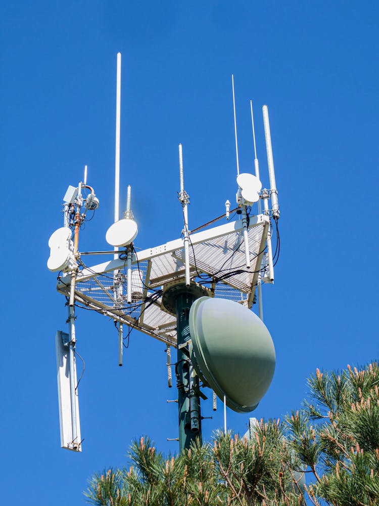 A Transmission Tower Against A Clear Blue Sky