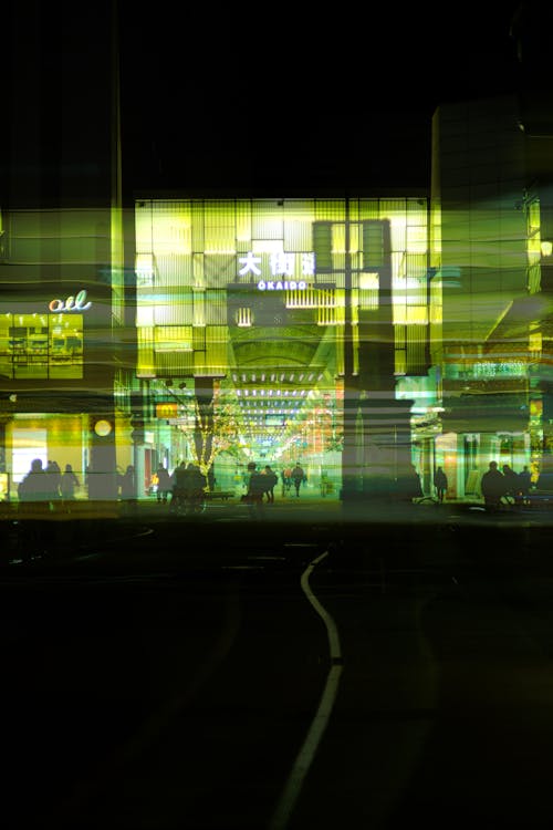 Facade of an Illuminated Shopping Mall in the Evening 